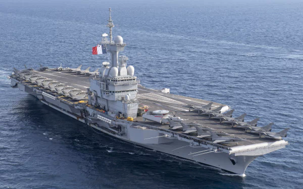 HD desktop wallpaper of the French Aircraft Carrier Charles De Gaulle (R91) at sea, showcasing this military warship and aircraft carrier in clear detail.