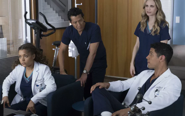 HD wallpaper from The Good Doctor featuring actors Antonia Thomas, Fiona Gubelmann, and Will Yun Lee in a medical setting.