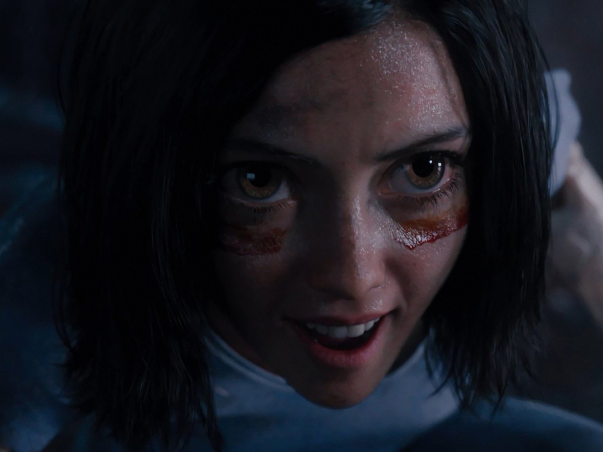 HD PC desktop wallpaper featuring a close-up of Alita from the movie Alita: Battle Angel, highlighting her intense expression and cybernetic details.