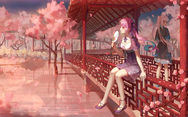 HD PC desktop wallpaper: Hololive anime Virtual YouTubers Kagura Mea and Minato Aqua on a cherry-blossom lakeside; one seated in a pavilion with a fan, petals drifting over reflective water.