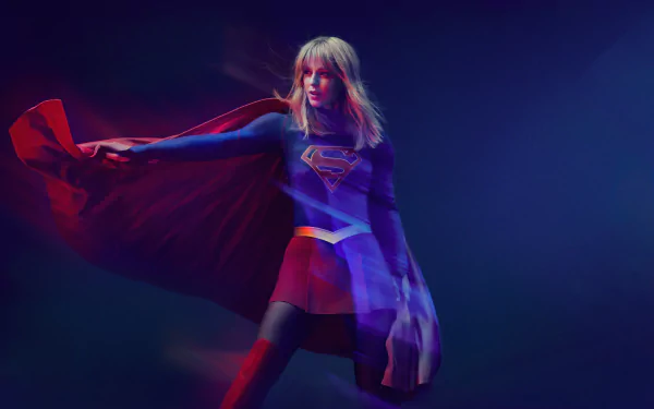 4K Ultra HD wallpaper featuring American actress Melissa Benoist as Supergirl from the TV show, posed dynamically with her red cape and costume against a dark background.