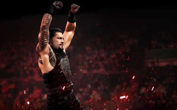 HD PC desktop wallpaper featuring WWE superstar Roman Reigns with arms raised, set against a dark, dynamic background with red sparks.