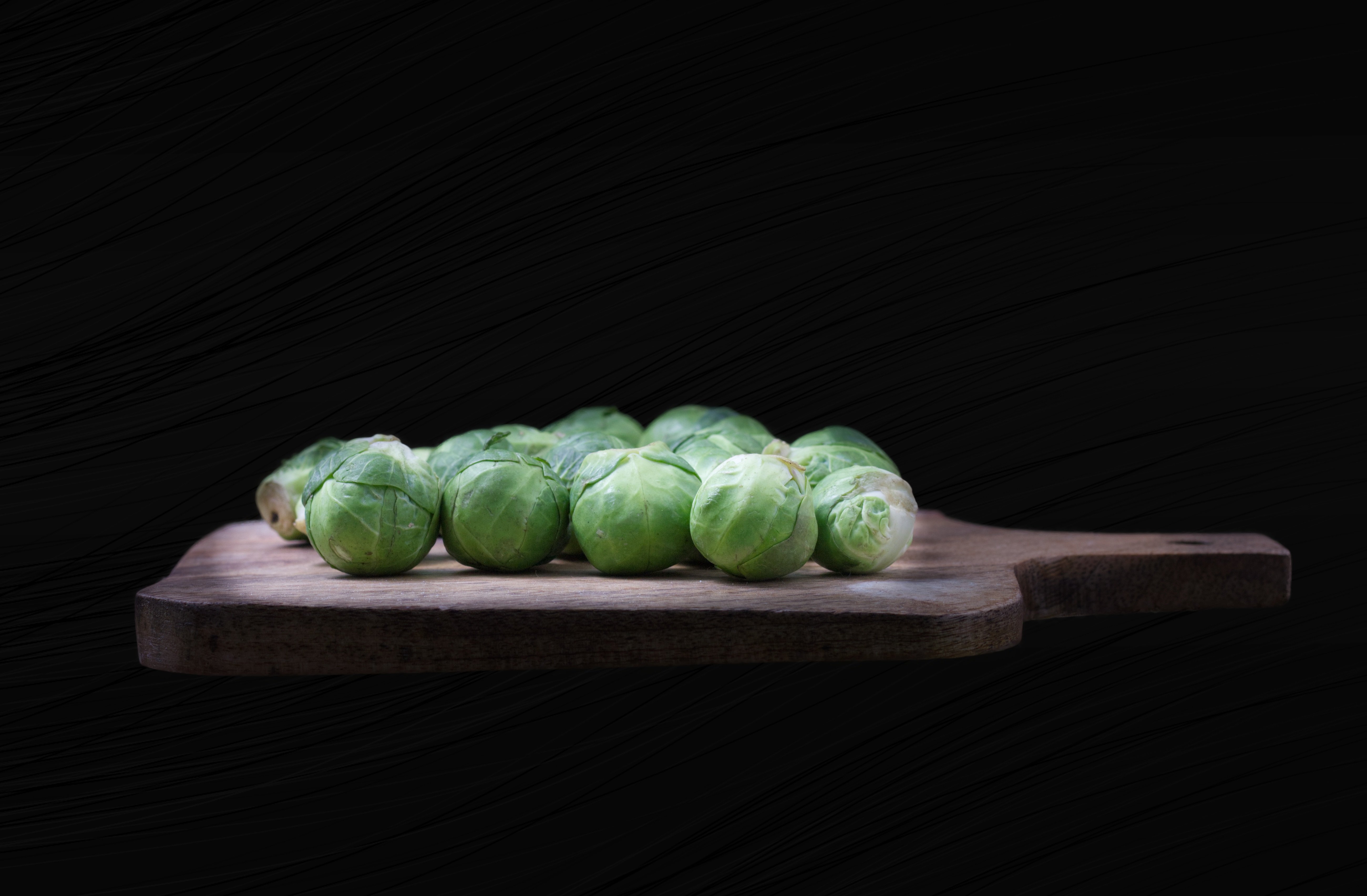 Brussels Sprouts on a Chopping Board by ktryna