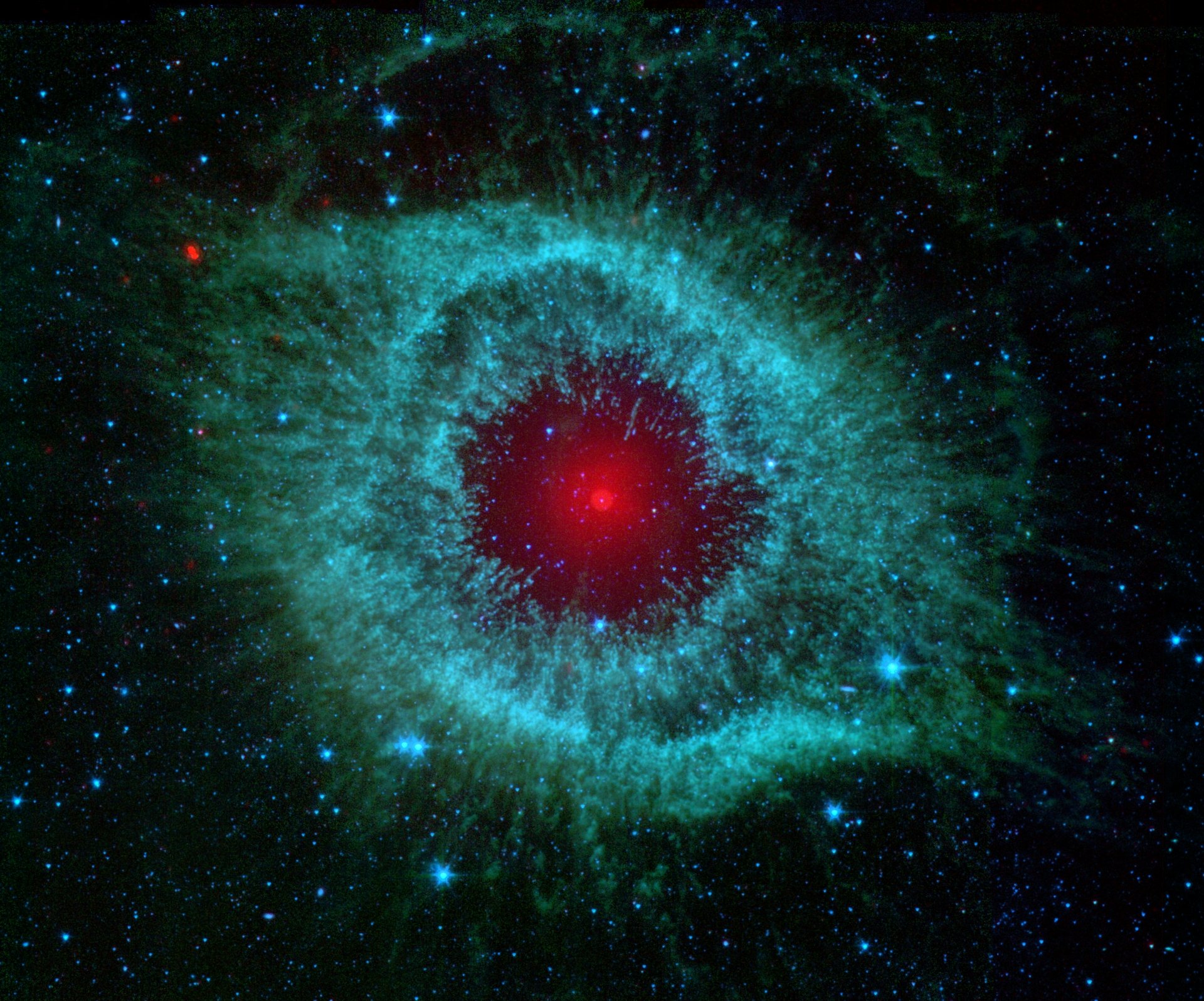 HD desktop wallpaper of the Helix Nebula, a mesmerizing space phenomenon, featuring a striking red core surrounded by a vibrant blue-green gaseous formation, set against a backdrop of stars. Sci-Fi aesthetic.