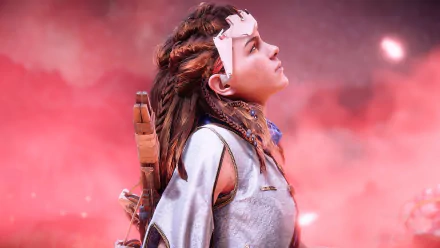 Aloy from Horizon Zero Dawn gazes upward against a vibrant red sky in this 4K Ultra HD PC desktop wallpaper from the Horizon video game series.