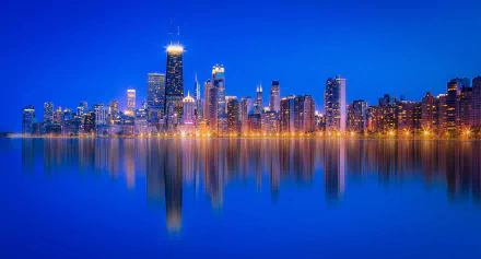 Chicago, USA night skyline along Lake Michigan with illuminated skyscrapers reflected on calm water — 4K Ultra HD PC desktop wallpaper background.