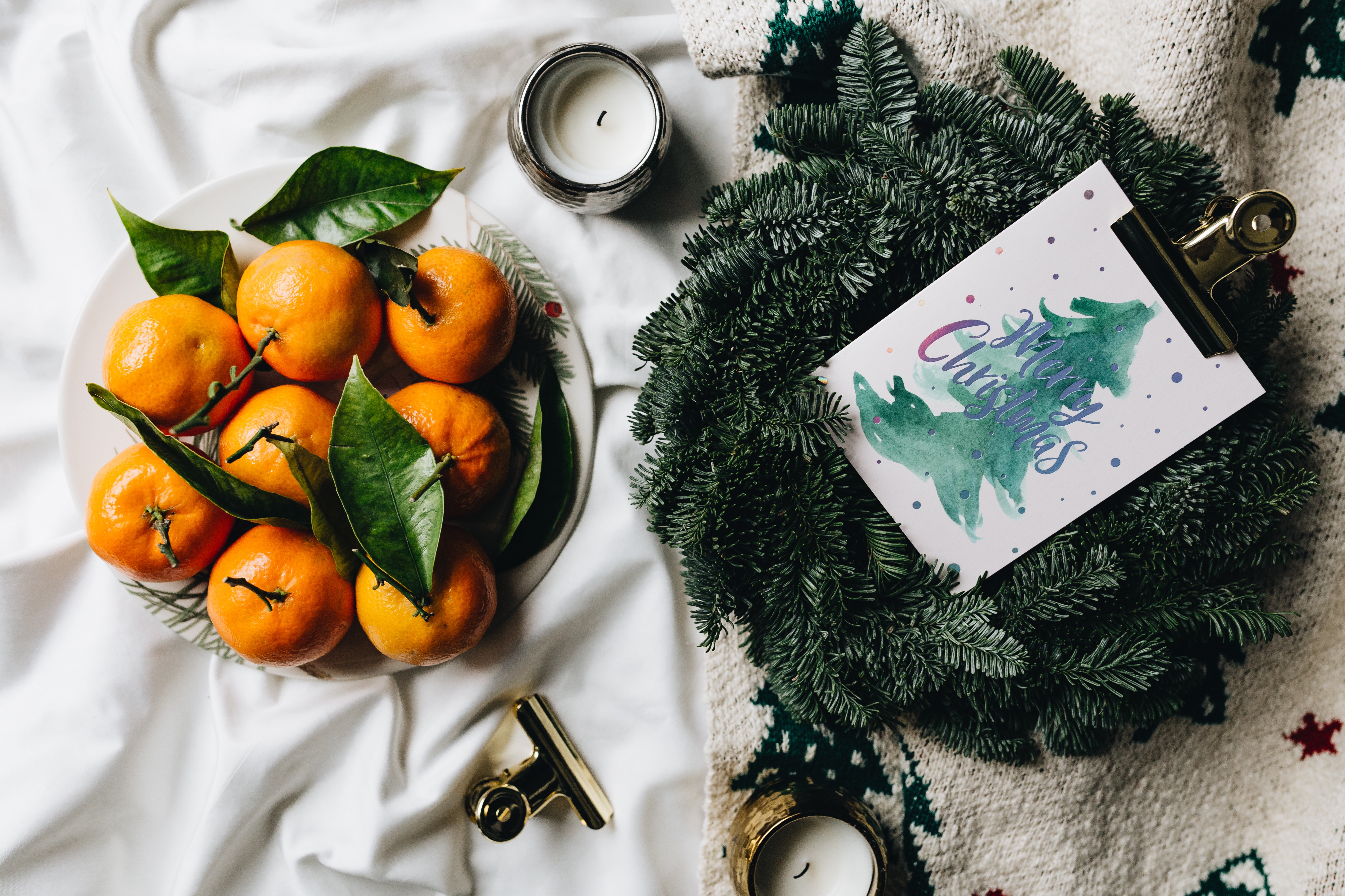 Tangerines on a simple natural Christmas wreath by Karolina Grabowska
