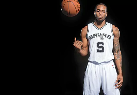 HD wallpaper of Kawhi Leonard in a Spurs jersey spinning a basketball on his finger against a dark background.