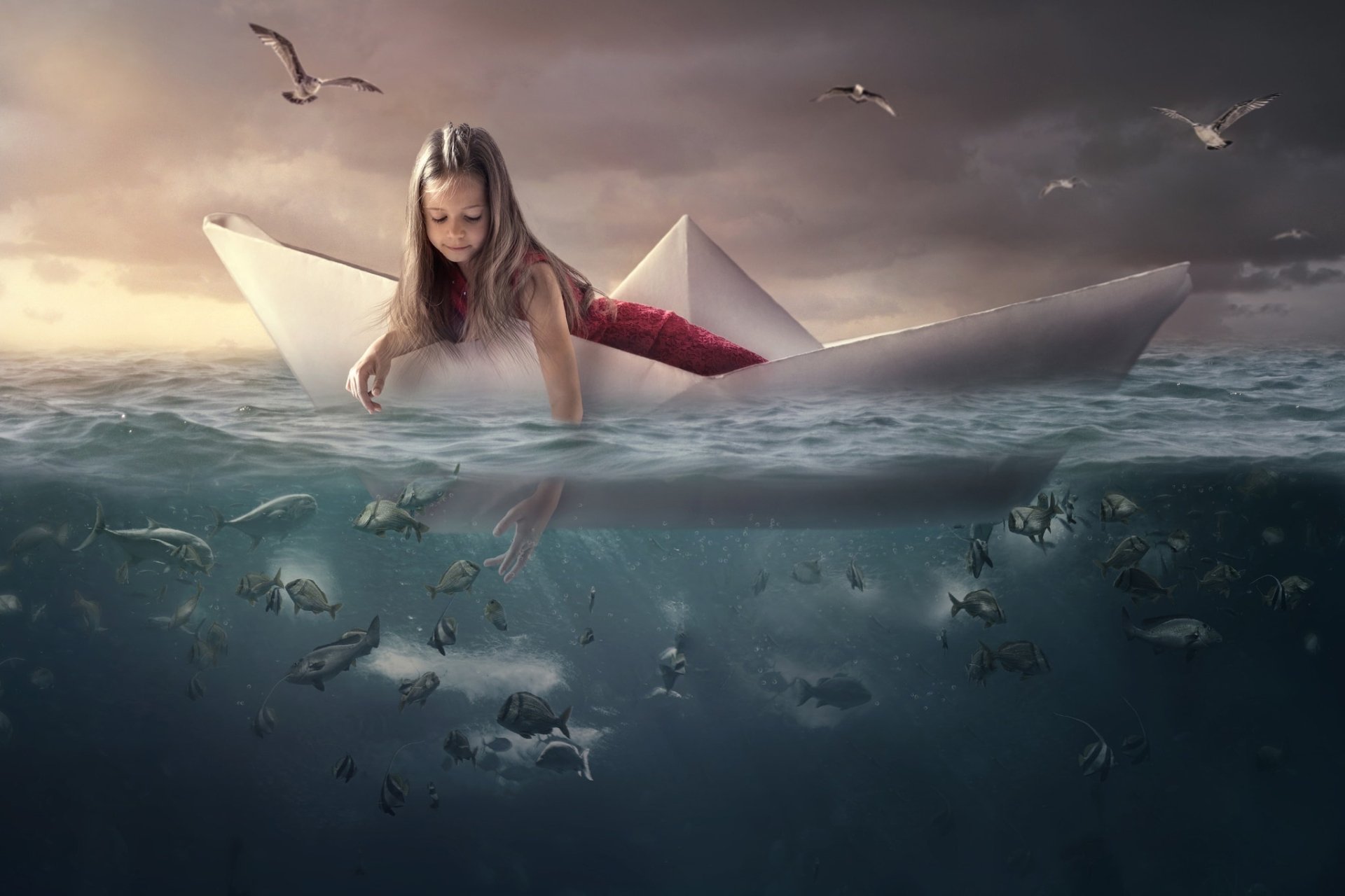 Young Girl on the Ocean on a Paper Boat. 