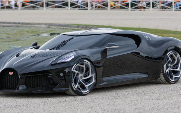 A sleek black Bugatti sports car parked outdoors, captured in 4K Ultra HD, serving as a high-resolution PC desktop wallpaper and background.