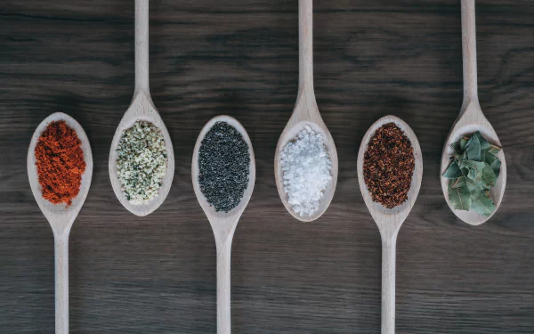  Variety of Herbs and Spices on Cooking Spoons