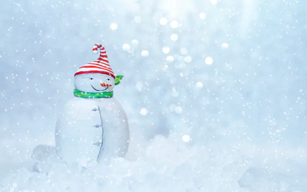 A festive snowman figurine with a striped hat and green scarf sits amid soft snowflakes in a 4K Ultra HD Christmas-themed desktop wallpaper.