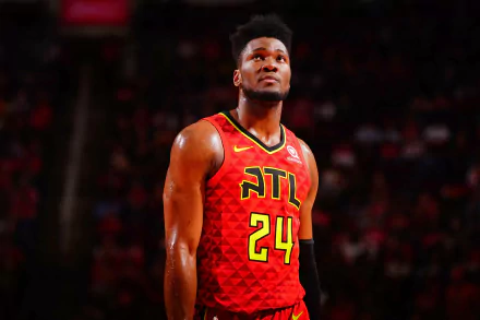 HD desktop wallpaper featuring a basketball player in an Atlanta Hawks jersey, number 24, on the court.