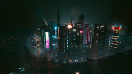 Night City skyline from Cyberpunk 2077 at night, showcasing neon-lit skyscrapers and a futuristic urban atmosphere in 4K Ultra HD for PC desktop wallpaper.