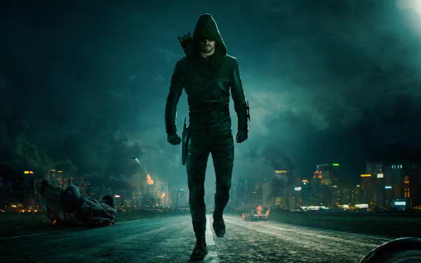 Stephen Amell as Oliver Queen from Arrow (TV Show) stands in a dark, foggy cityscape, featured in a 4K Ultra HD PC desktop wallpaper and background.