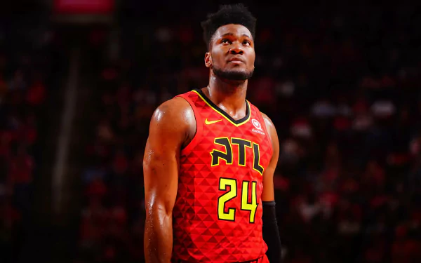 HD desktop wallpaper featuring a basketball player in an Atlanta Hawks jersey, number 24, on the court.