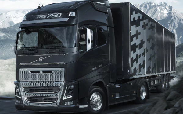 A Volvo FH16 750 truck on a mountain road, serving as an HD desktop wallpaper and background.