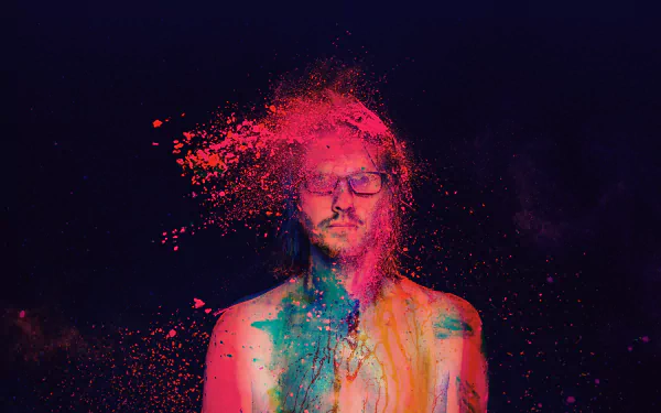 HD desktop wallpaper of a person with a colorful dust effect on a dark background, tagged as Steven Wilson.