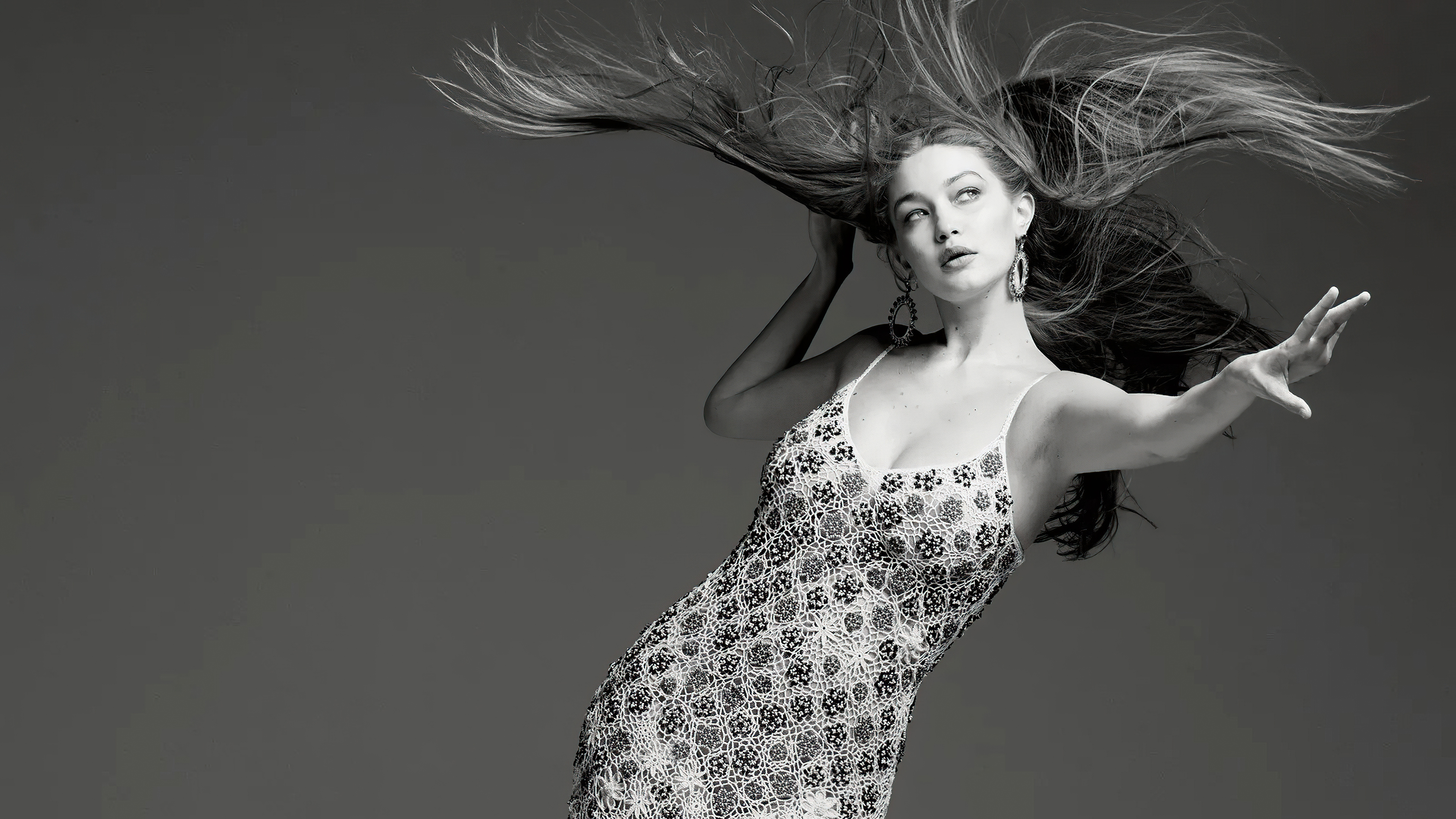 gigi hadid black and white dress next in fashion Gigi Hadid Just Wore This Heel Color Trend With a Boho Dress