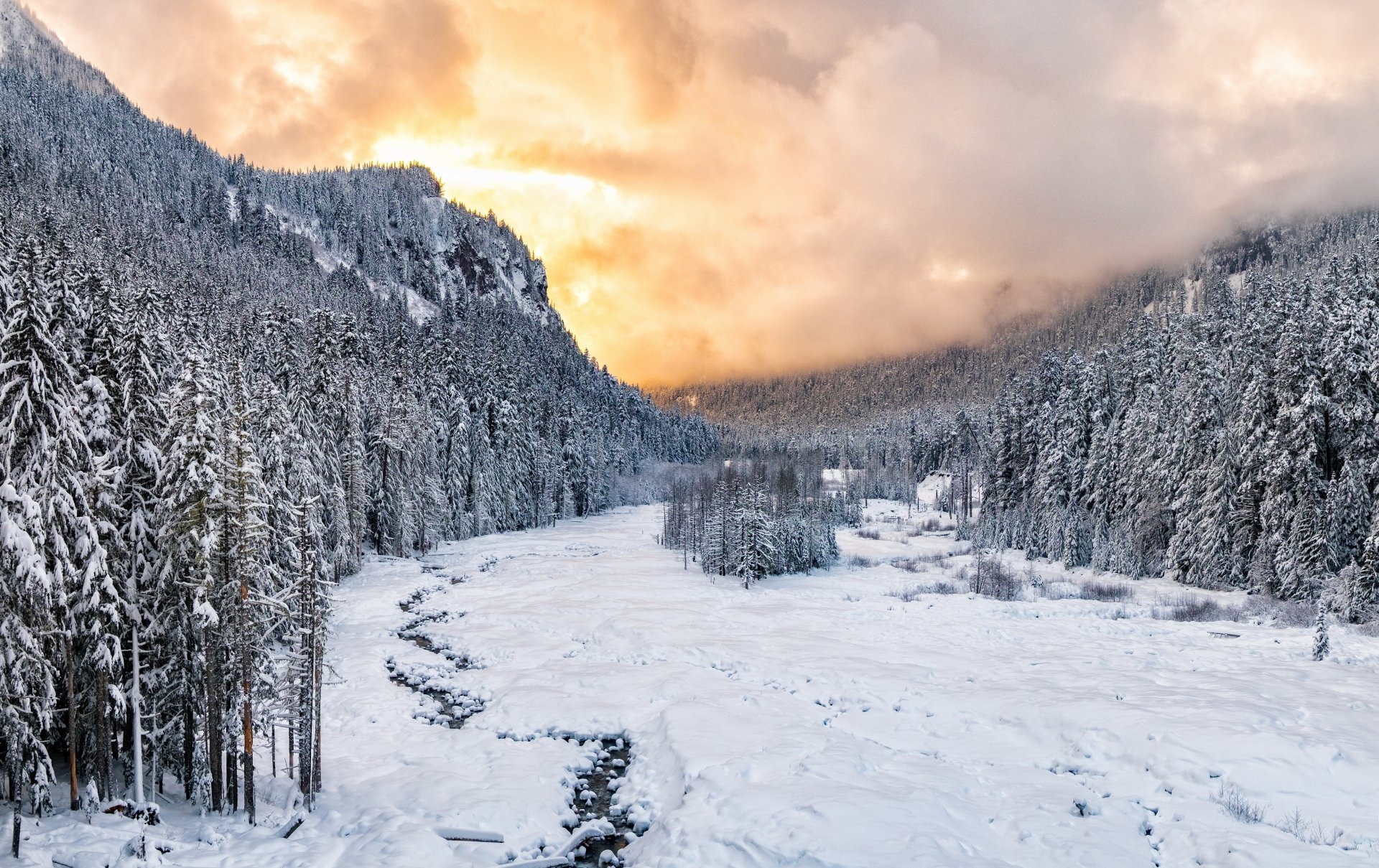 Snow-covered national park landscape at sunset in winter, captured in stunning 4K Ultra HD quality.