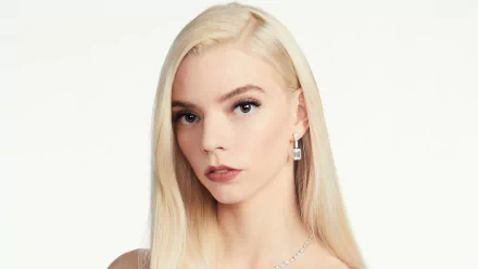 Close-up 4K Ultra HD image of American actress Anya Taylor-Joy with blonde hair and a neutral expression against a plain background.