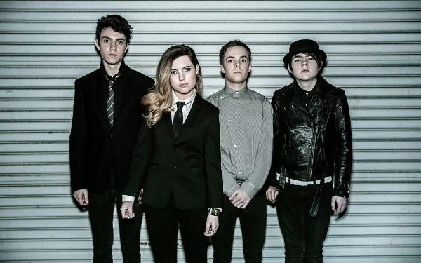 HD wallpaper featuring the band Echosmith with member Sydney Sierota, posing in front of a striped background.