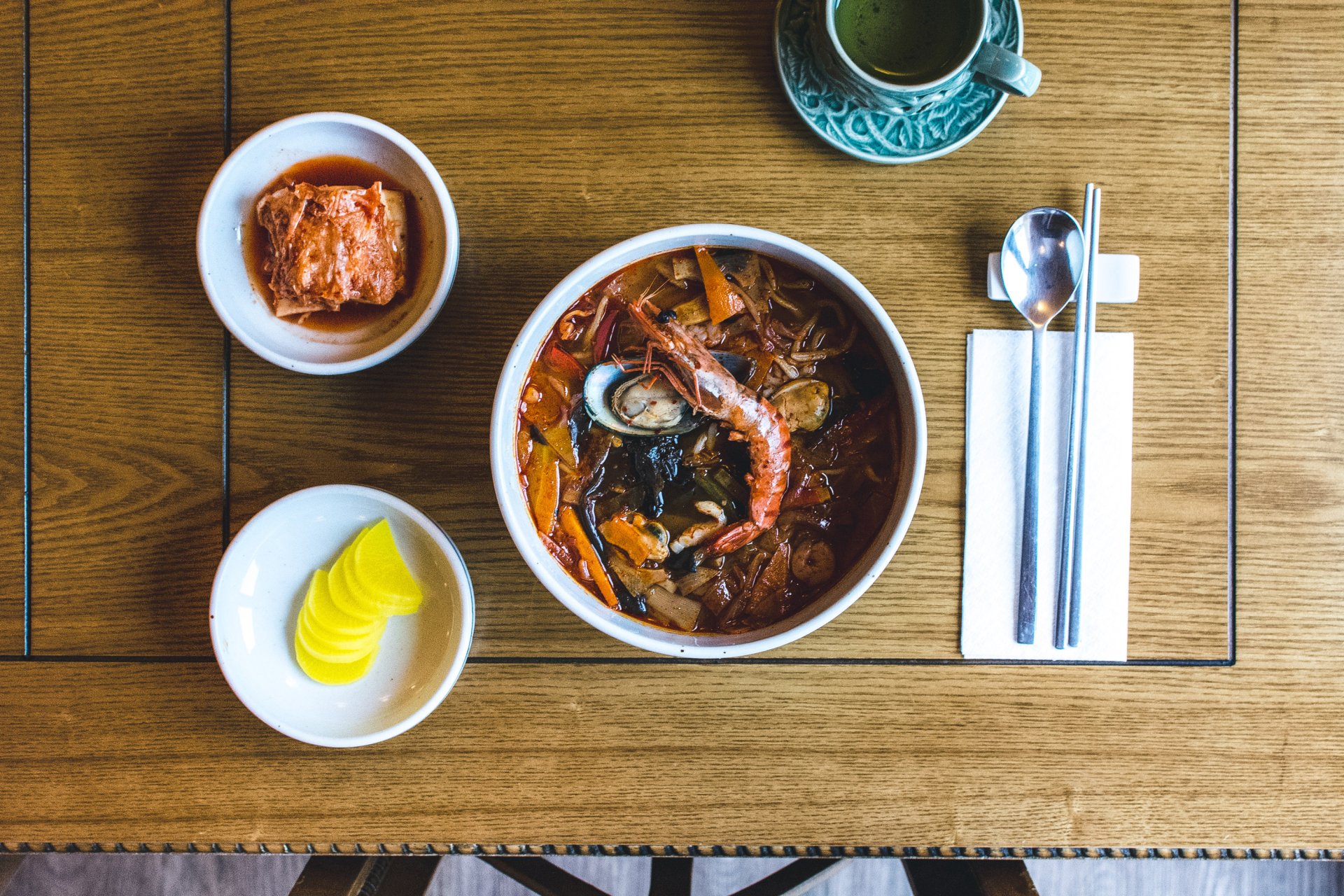 Korean spicy seafood soup with king prawns from top view ...