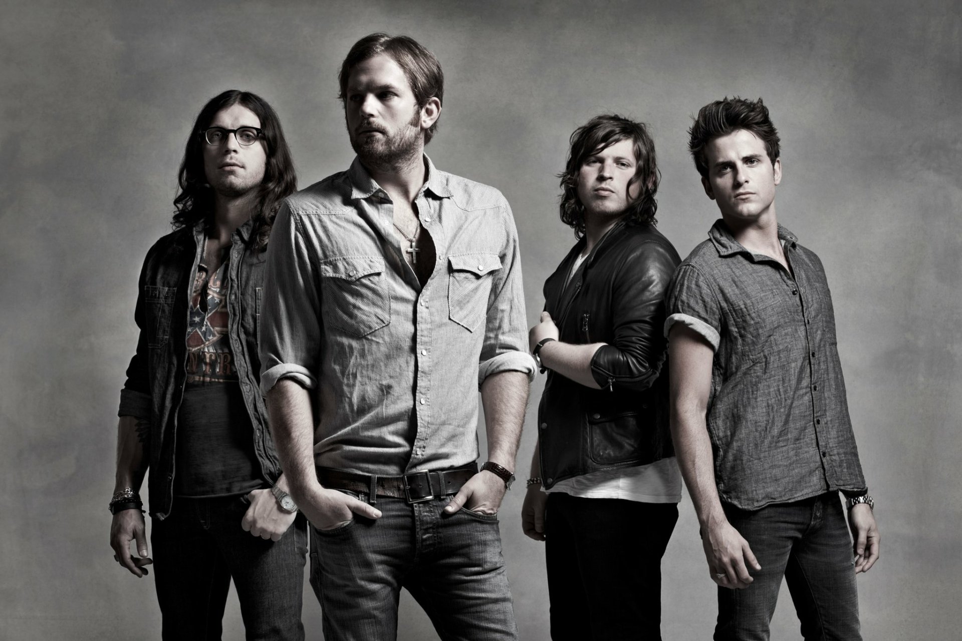HD wallpaper featuring the band Kings Of Leon, posing in a monochrome setting for a stylish desktop background.