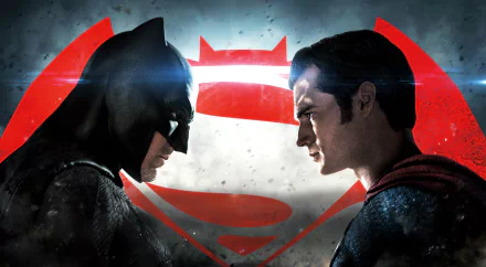 HD wallpaper featuring Ben Affleck as Batman and Henry Cavill as Superman, facing off against each other, with the iconic Batman V Superman: Dawn of Justice logo in the background.