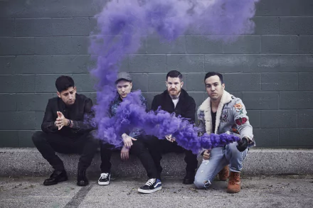 HD desktop wallpaper featuring a group of four musicians sitting against a wall with purple smoke for a creative and edgy background look.