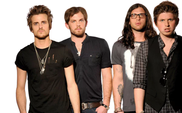 HD desktop wallpaper featuring the members of Kings Of Leon posing against a neutral background.