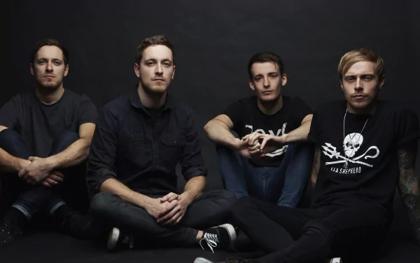 HD desktop wallpaper featuring four individuals against a dark background, suitable as a background for fans of the tagged theme, Architects.