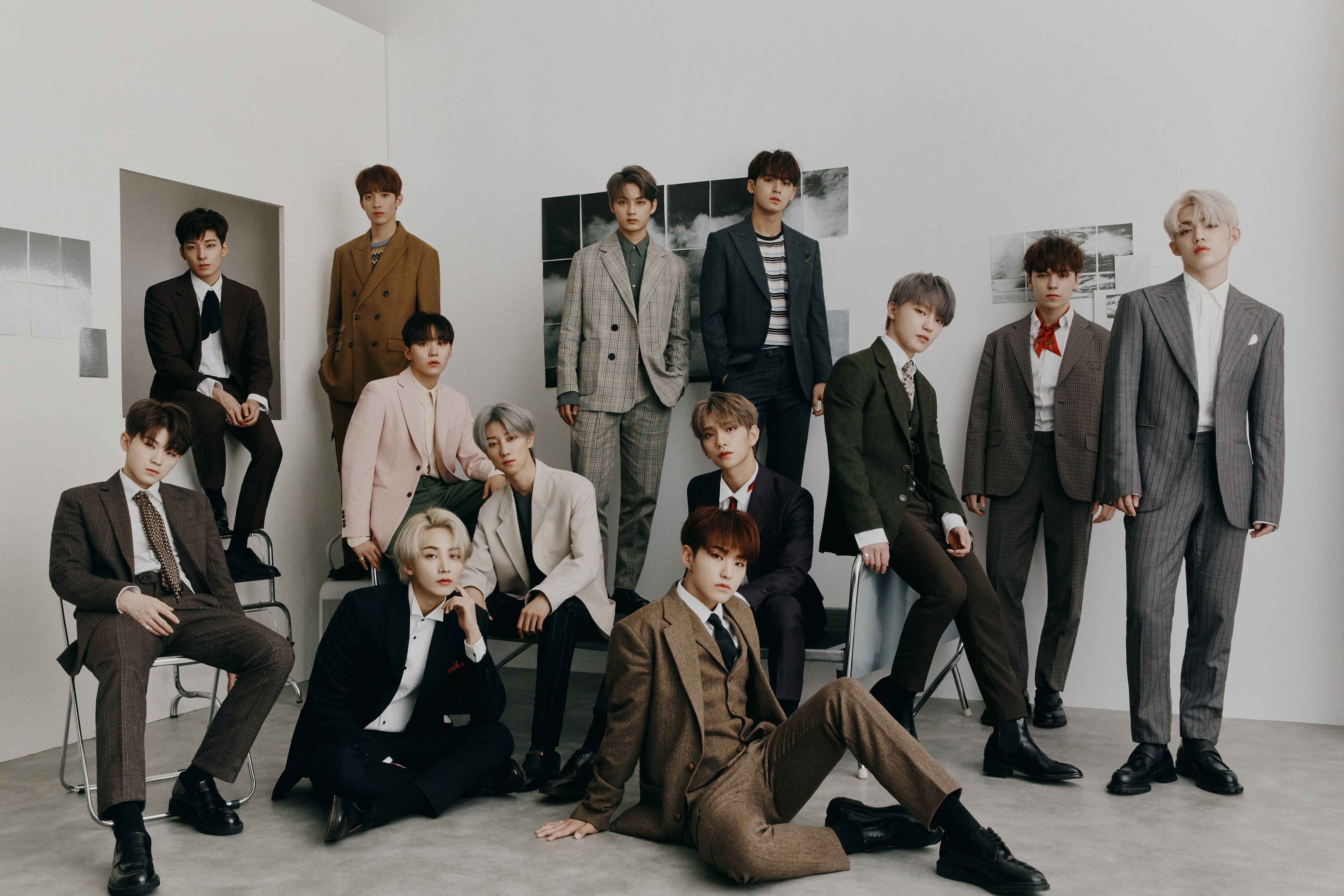 HD desktop wallpaper featuring a group of stylish individuals posing in a modern setting, perfect for fans of Seventeen.