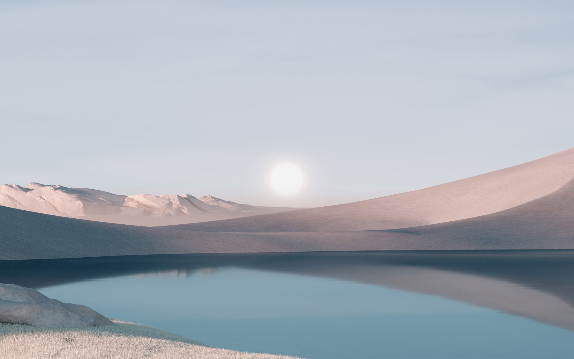 4K Windows 11 desktop wallpaper: pastel sunrise over a tranquil lake, soft sand dunes and distant snowy peaks reflected in glassy water.