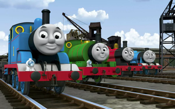 HD PC desktop wallpaper featuring Percy, Thomas the Tank Engine, and other characters from the TV show Thomas & Friends lined up on railway tracks under a partly cloudy sky.