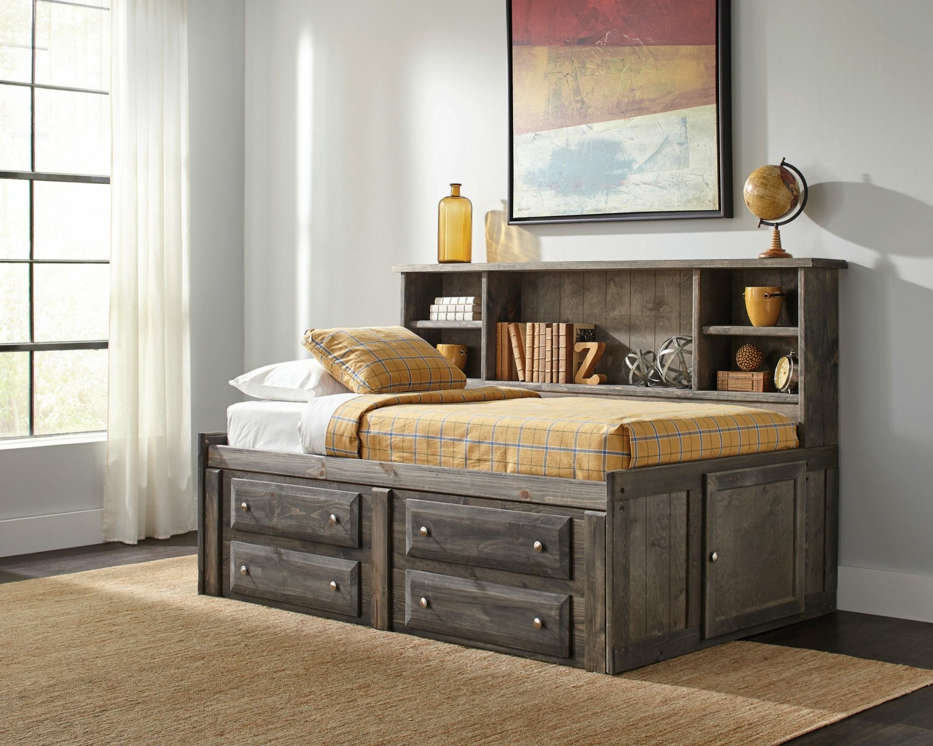 A cozy, wooden bed with storage drawers and a headboard filled with books and decor, set against a bright, airy room with large windows. HD desktop wallpaper.