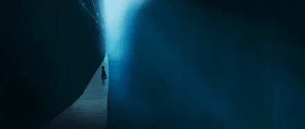 4K Ultra HD PC desktop anime wallpaper: lone anime girl walks down a narrow, shadowed corridor toward a distant blue light.