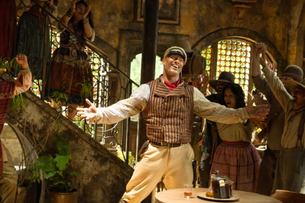 HD PC desktop wallpaper featuring a vibrant scene from the movie Jungle Cruise with Dwayne Johnson’s character in a lively marketplace setting.