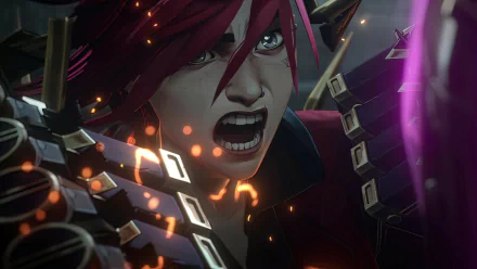Close-up of VI from League of Legends, featured in the animated series Arcane. The character exhibits intense emotion with striking red hair and dynamic background effects.