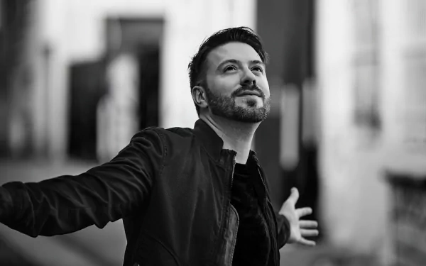 Man in black jacket spreading arms in black and white HD desktop wallpaper