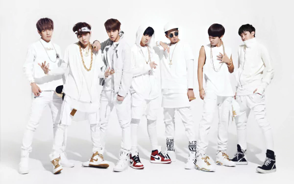4K Ultra HD PC wallpaper of a seven-member K-pop group in coordinated white streetwear, posing against a clean white background with a stylish, music-themed vibe.