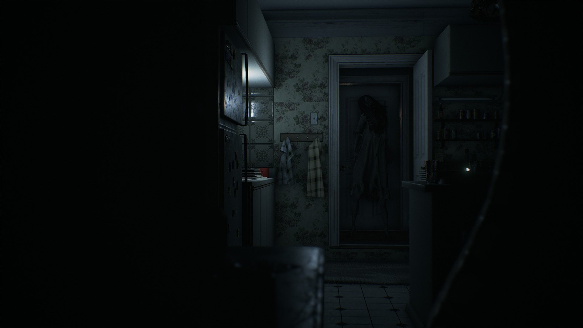 An eerie HD desktop wallpaper featuring a dark, unsettling corridor from the video game Visage, highlighting shadows and a mysterious presence at the end of the hallway.