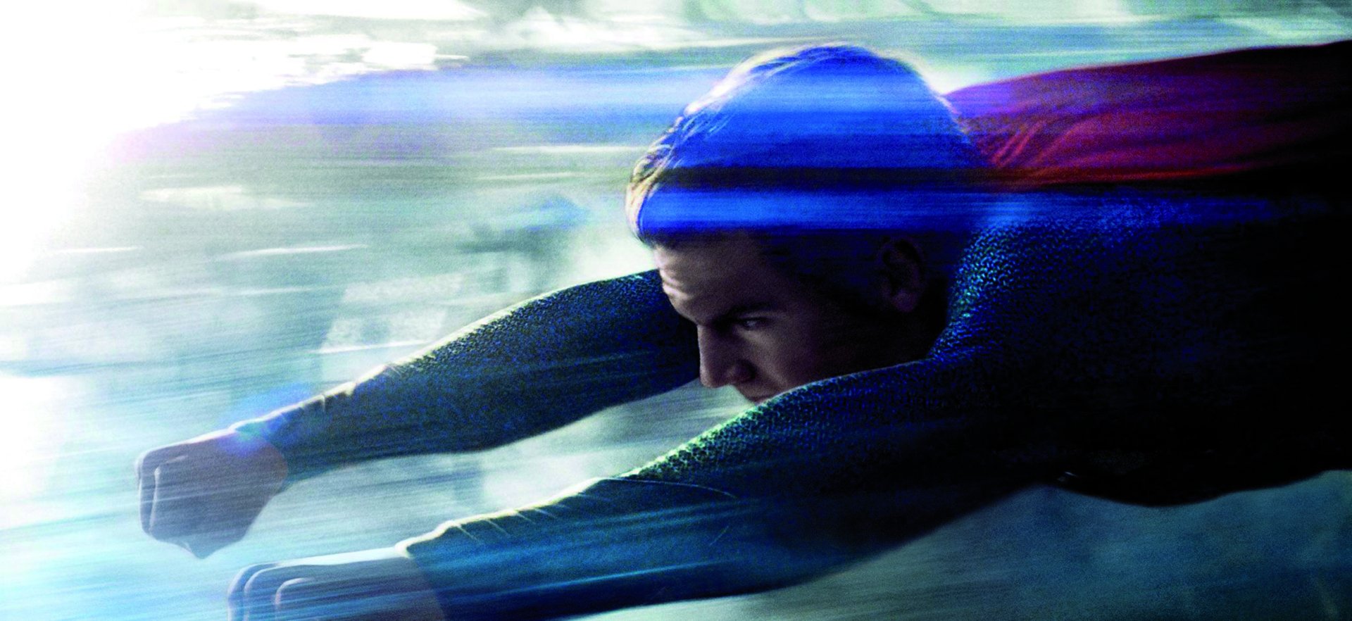 Henry Cavill as Superman in a dynamic flying pose from the Man of Steel movie, shown in a vivid 4K Ultra HD PC desktop wallpaper.