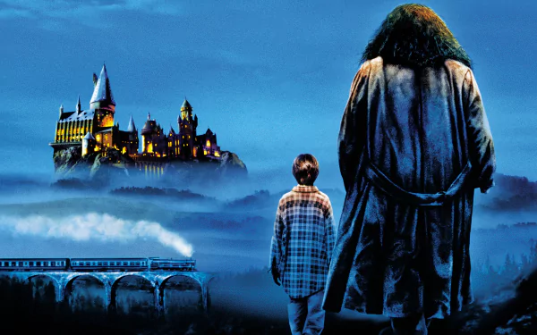 Rubeus Hagrid and young Harry stand on a misty cliff, gazing at illuminated Hogwarts and a viaduct — 2K Quad HD wallpaper from the movie Harry Potter and the Philosopher's Stone.
