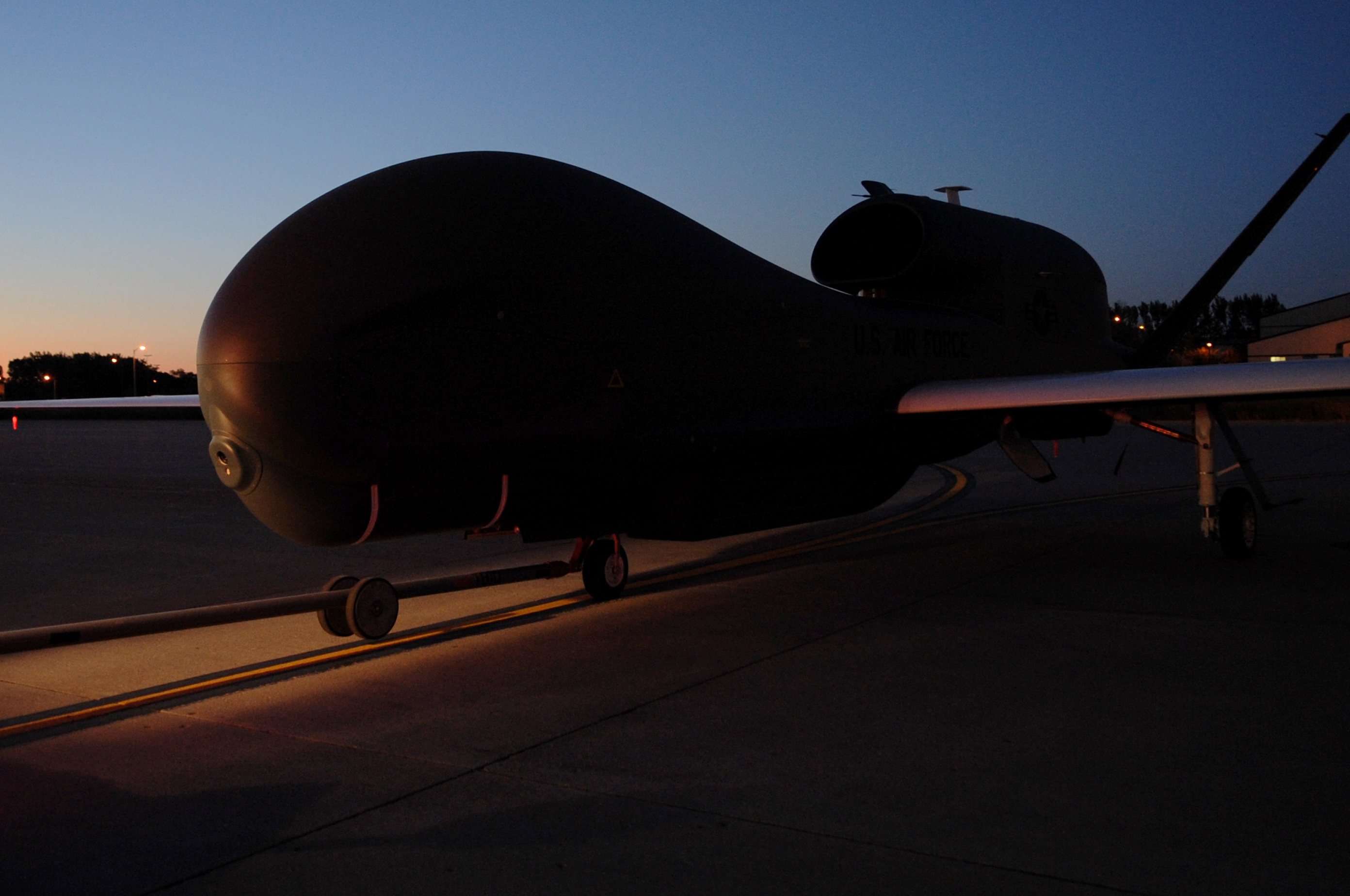 RQ-4 Global Hawk unmanned aircraft reconnaissance system is moved on the flight line on Grand Forks by US Air Force