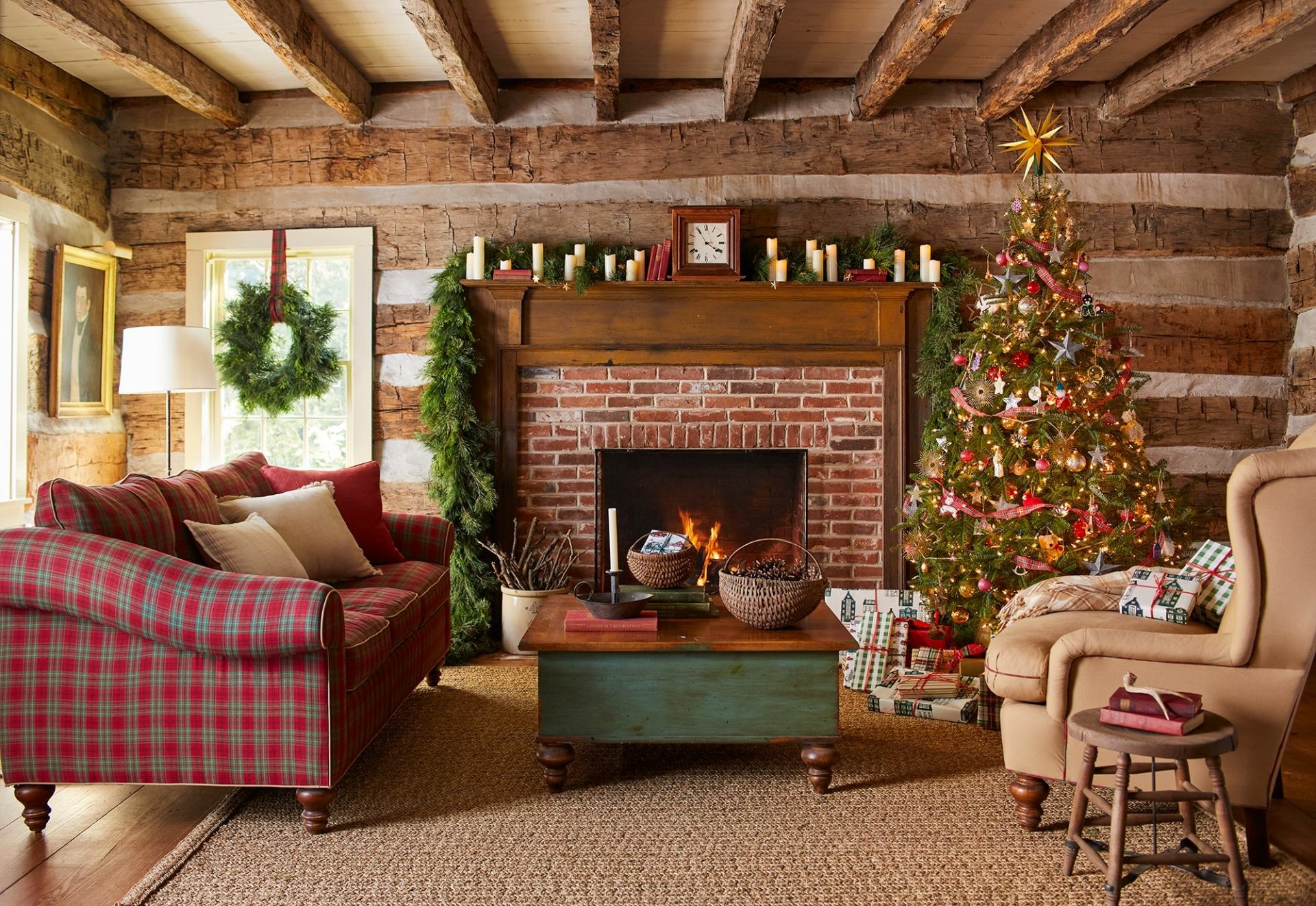 Cozy man-made room with rustic wooden beams, a decorated Christmas tree, and a warm fireplace, featured as an HD PC desktop wallpaper and background.