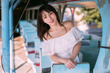 Smiling young woman with black hair leaning on a turquoise railing in a sunlit outdoor scene — 4K Ultra HD PC desktop wallpaper/background.