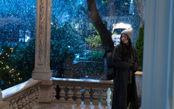 Kate Bishop, played by Hailee Steinfeld, stands on a snowy porch in a scene from the Hawkeye TV show, captured in stunning 4K Ultra HD for a PC desktop wallpaper.