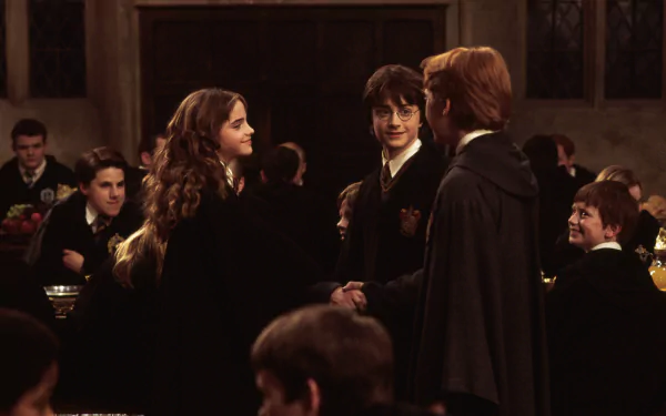 HD PC wallpaper: scene from Harry Potter and the Chamber of Secrets — Hermione Granger, Harry Potter and Ron Weasley talking in the Hogwarts Great Hall.