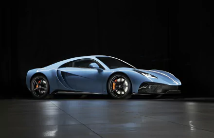 Blue Noble M500 supercar on a reflective floor against a black backdrop — 5K Ultra HD PC desktop wallpaper background.